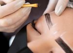 beautician-doing-microblading-treatment-client-s-eyebrows_23-2149183866