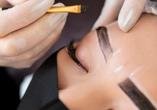 beautician-doing-microblading-treatment-client-s-eyebrows_23-2149183866